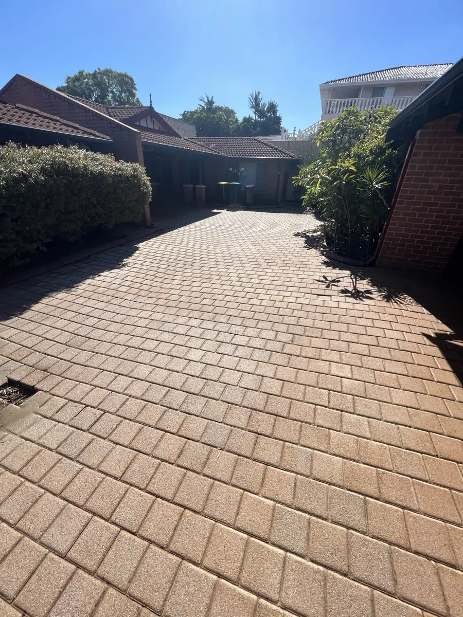The same driveway cleaned back to clean red brick