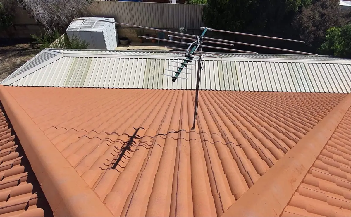 Same roof clear of algae after the biocide treatment weathered the growth off