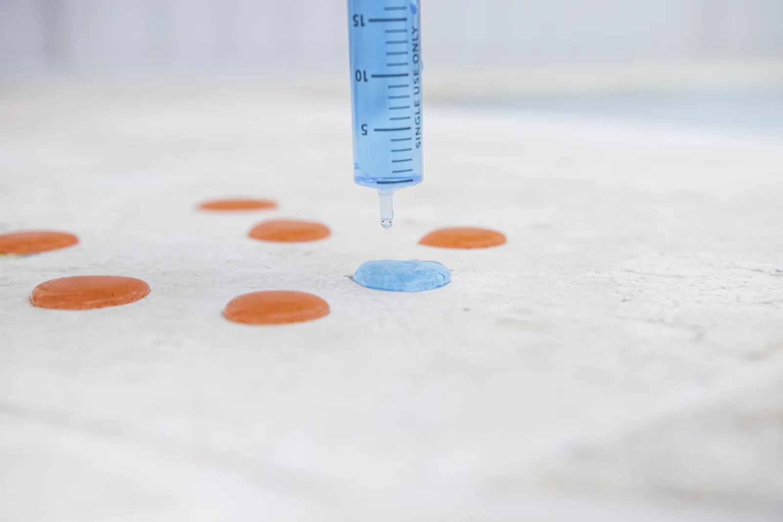 Water beading on a sealed outdoor stone benchtop surface